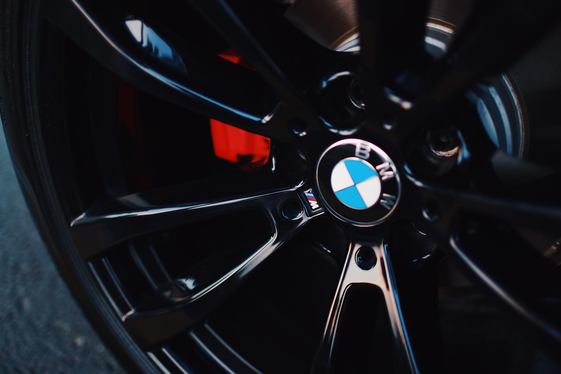 black BMW 5-spoke vehicle wheel with tire